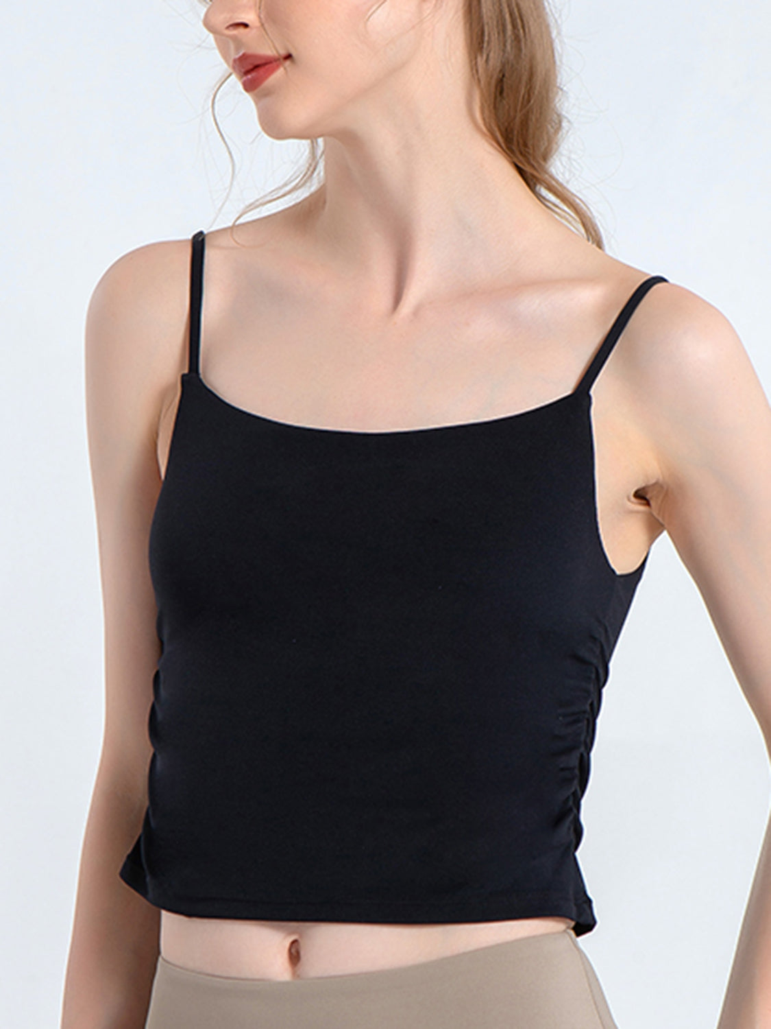 Black ruched sports cami with spaghetti straps and scoop neckline