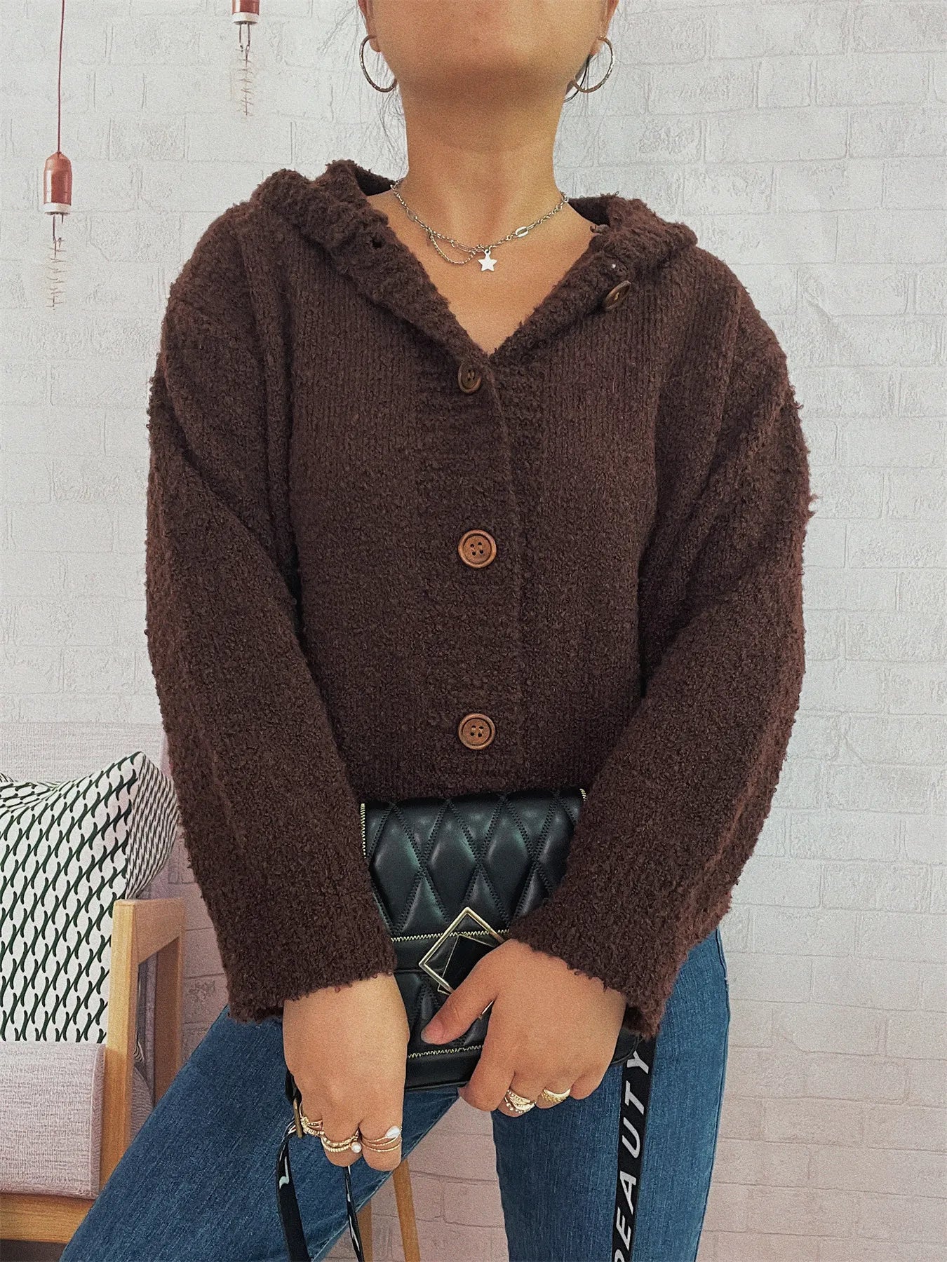 Brown hooded cardigan with long sleeves and front buttons in fuzzy textured knit