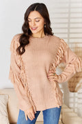 Dusty pink long sleeve sweater with fringe tassel details on sleeves and shoulders