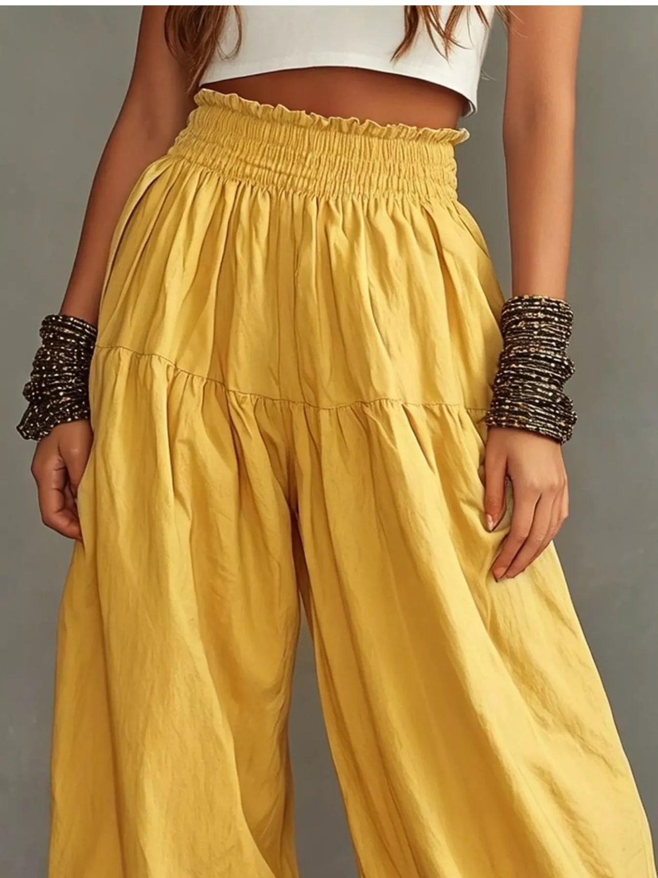 Mustard yellow smocked waist wide-leg pants with gathered tiers