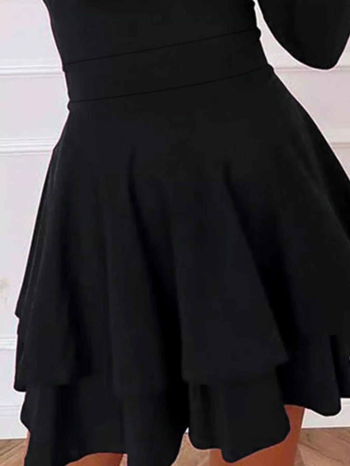 Black tiered ruffle mini skirt with long sleeves and V-neck