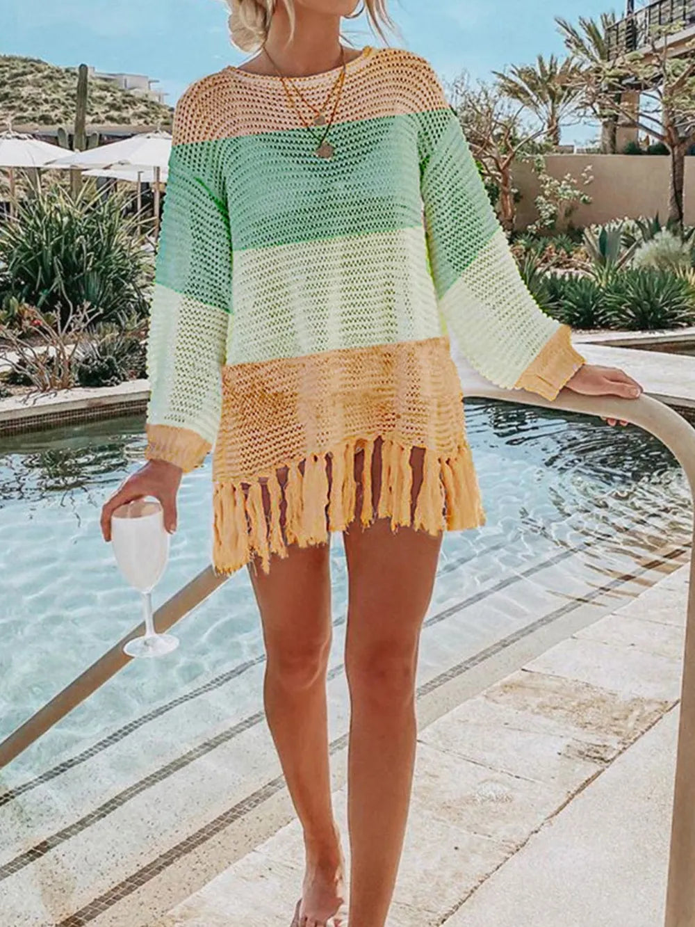 Green and cream colorblock knit cover up with tassel fringe hem.