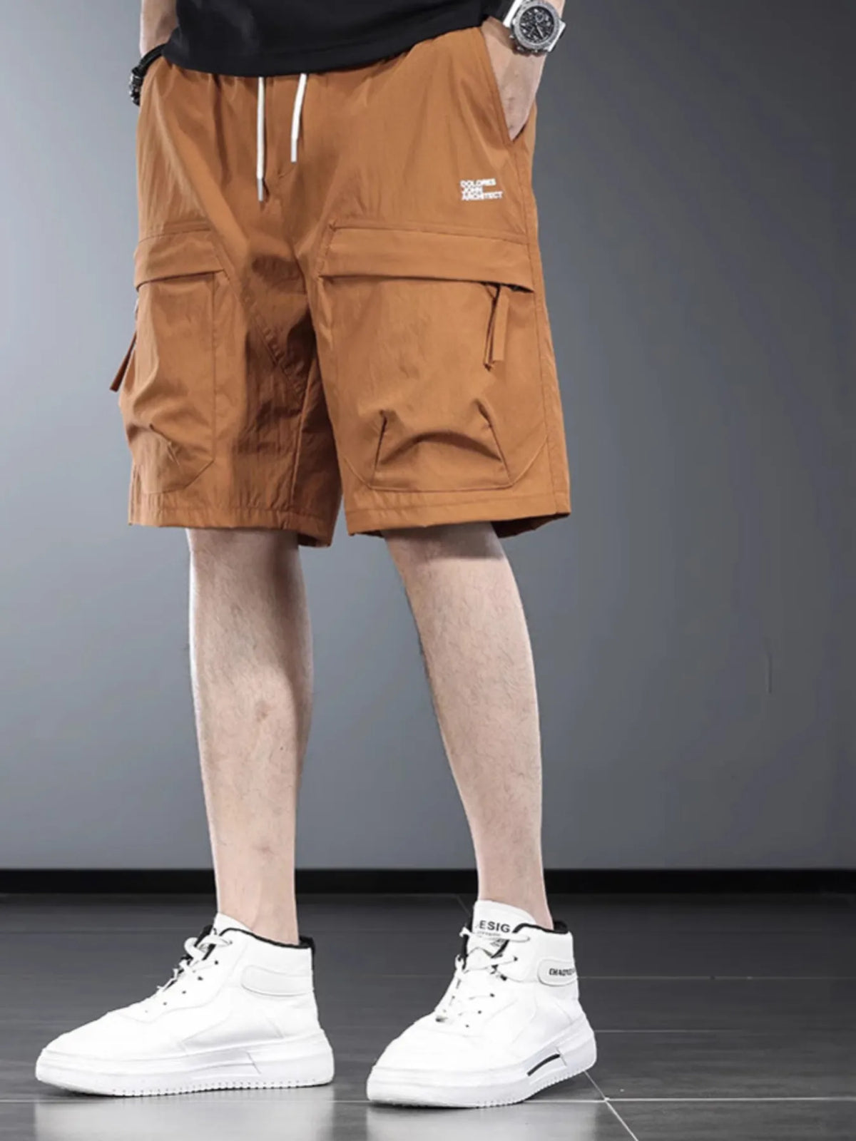 Men's cargo shorts in orange-brown with drawstring waist and side pockets