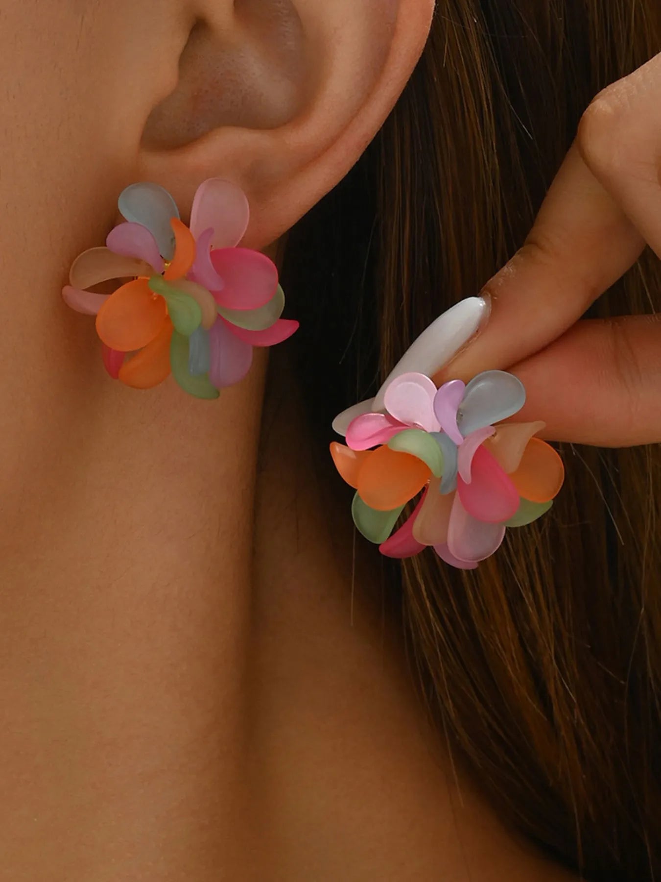 Colorful flower stud earrings with pastel orange, pink, and mint petals