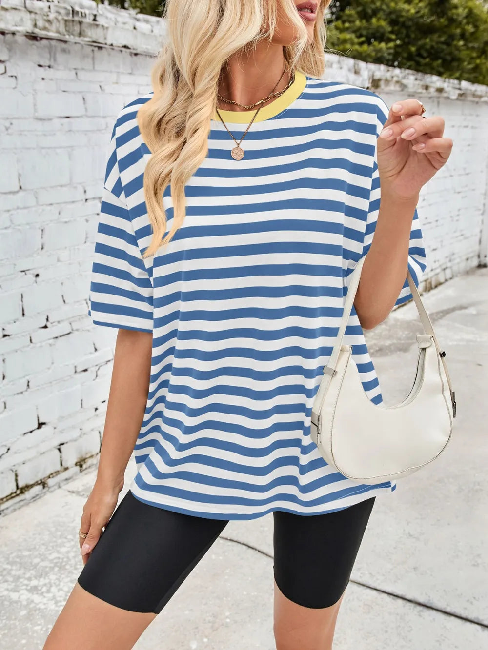 Blue striped round-neck half-sleeve T-shirt, draped hem, front view.