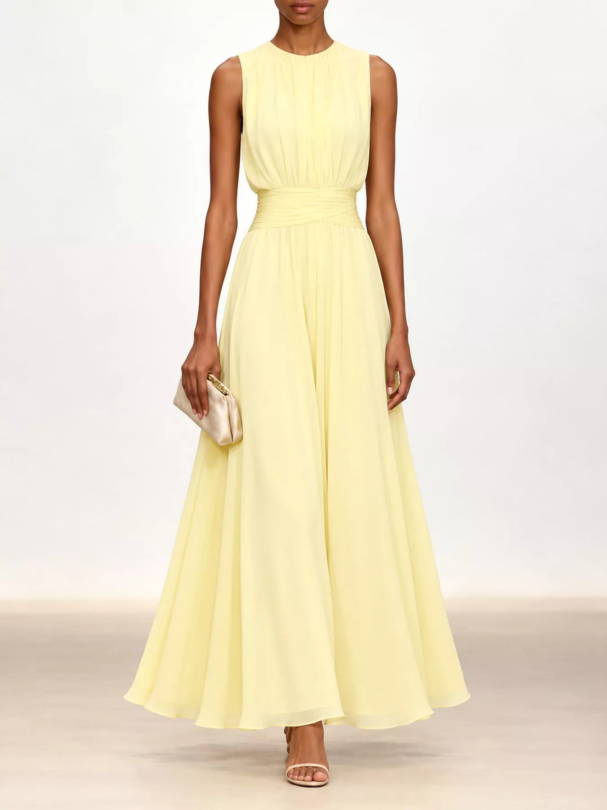 Light yellow sleeveless ruched chiffon maxi dress with gathered waist and flowing skirt