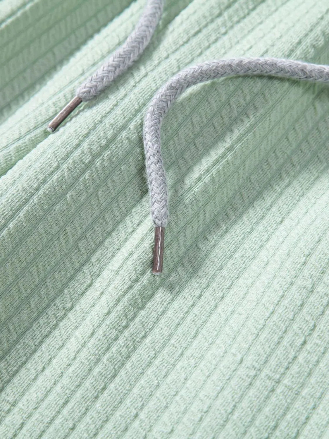 Mint green ribbed shirt neckline with drawstring and eyelet cord