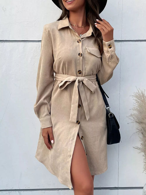 Tan button-front tie-waist shirt dress with long sleeves and pointed collar