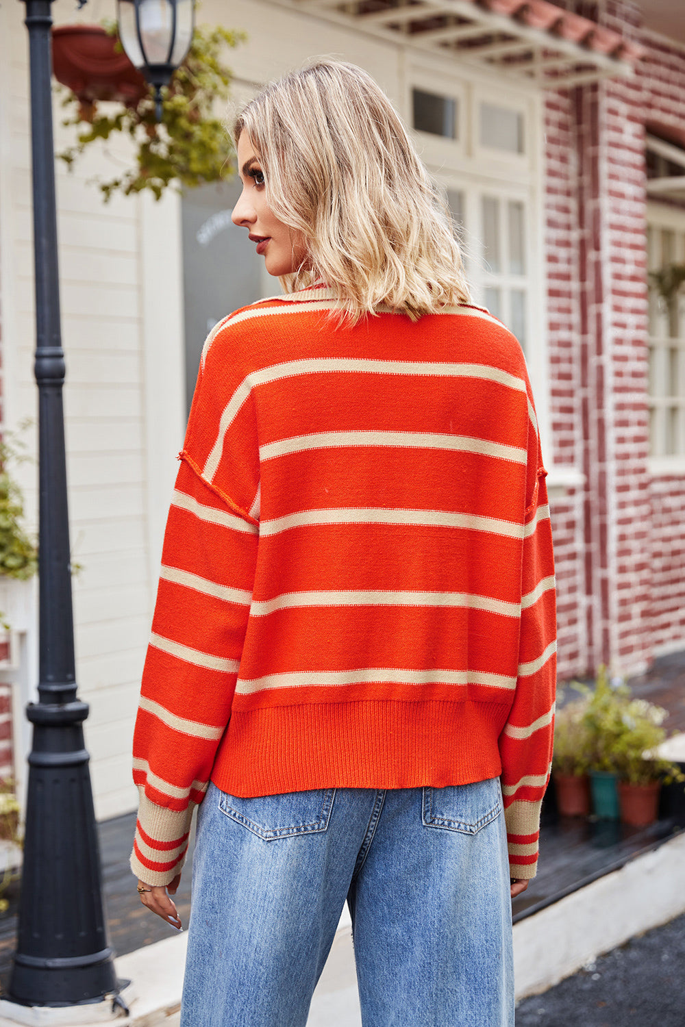 Striped Johnny-collar sweater in red and white, long sleeves, back view