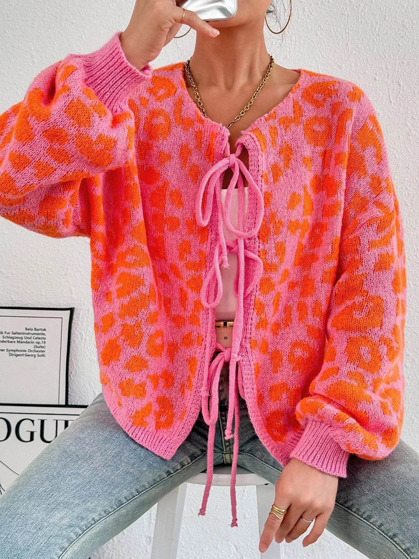 Leopard tie-front cardigan, orange knit with pink laced V neckline and ribbed cuffs