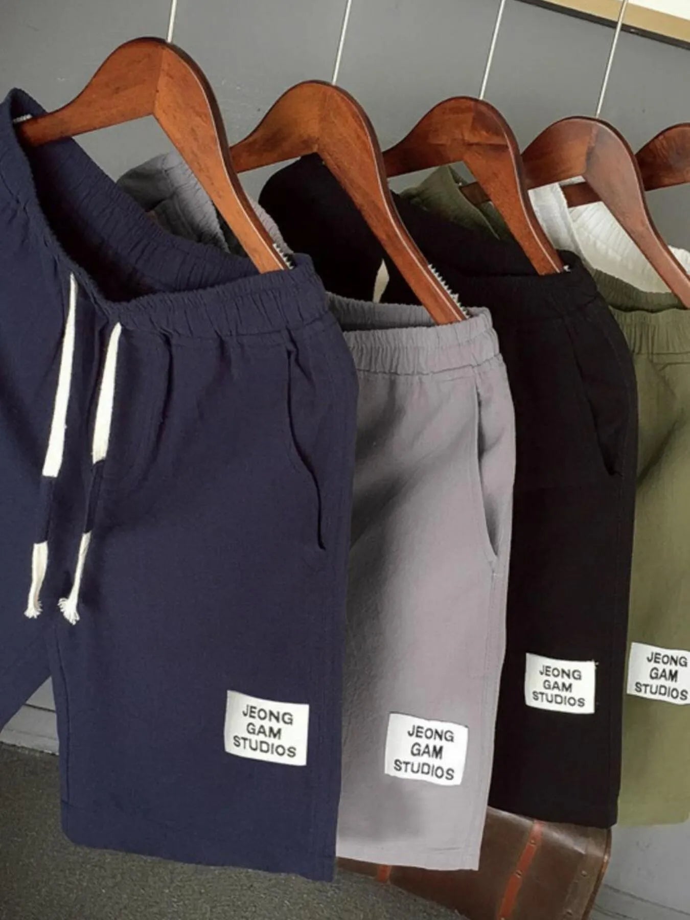 Men's plus size drawstring shorts, assorted colors on hangers