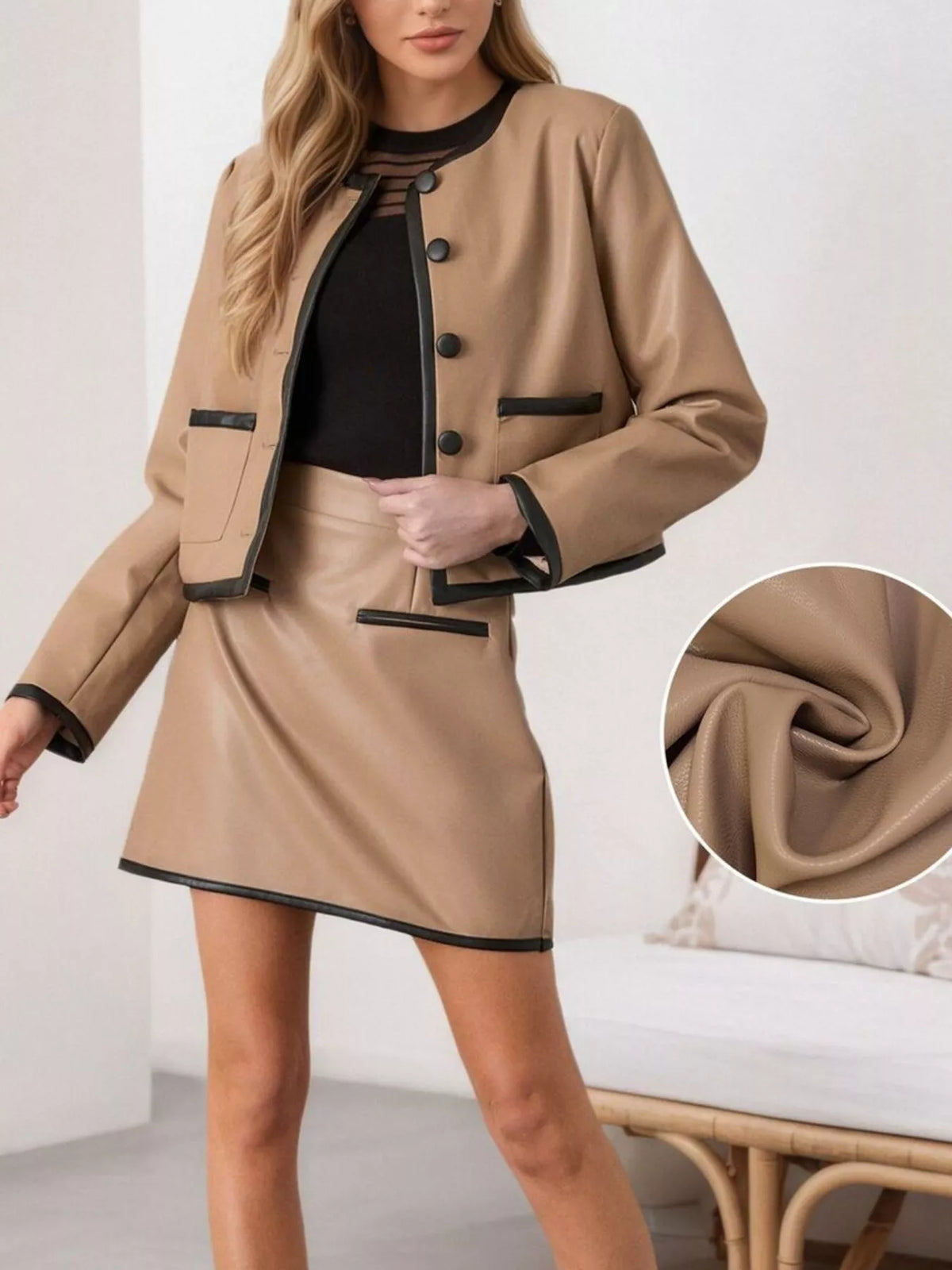 Tan two-piece jacket and skirt set with black contrast trim and button front
