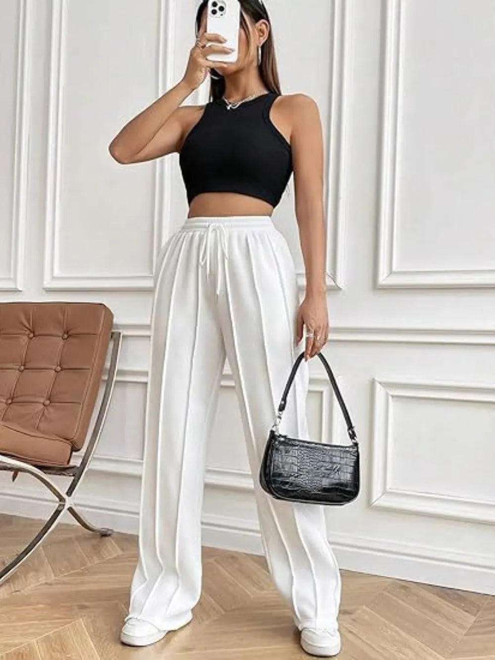 White wide-leg drawstring pants with pockets and elastic waistband, front view