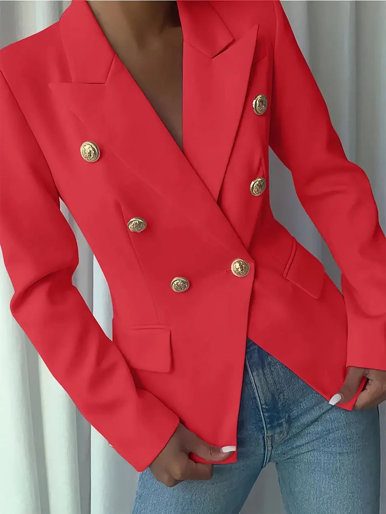 Red double-breasted blazer with gold decorative buttons and front flap pockets