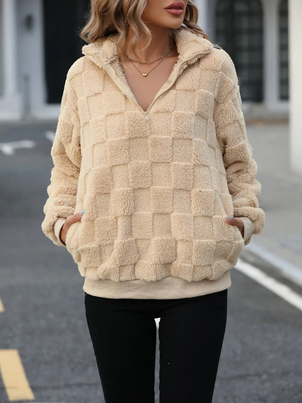 Tan fuzzy quarter-zip sweatshirt, check texture, long sleeves and relaxed fit.