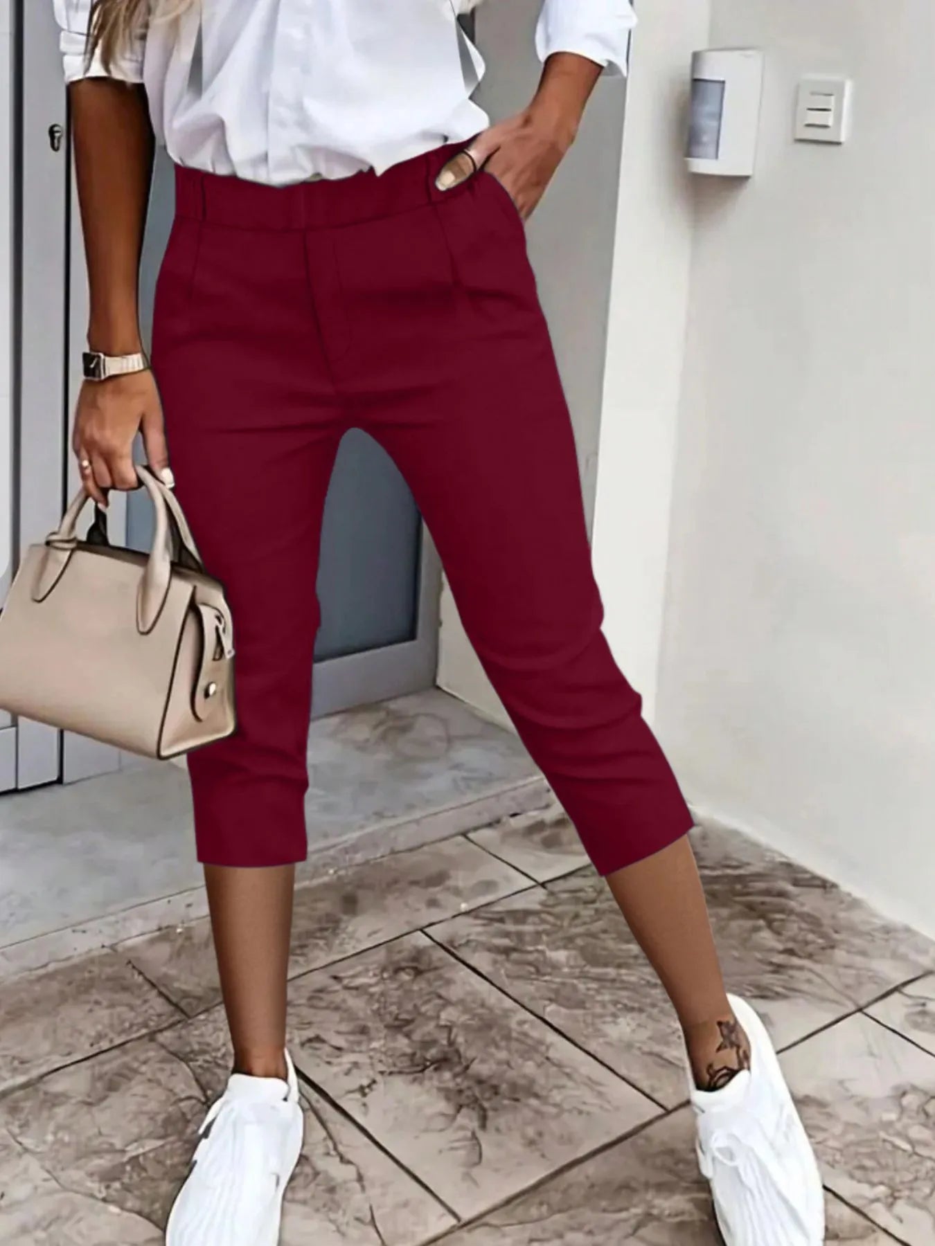Burgundy pleated detail capri pants with front pockets and belt loops