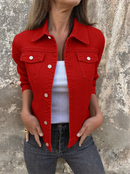 Red button front denim jacket with collared neckline and chest flap pockets