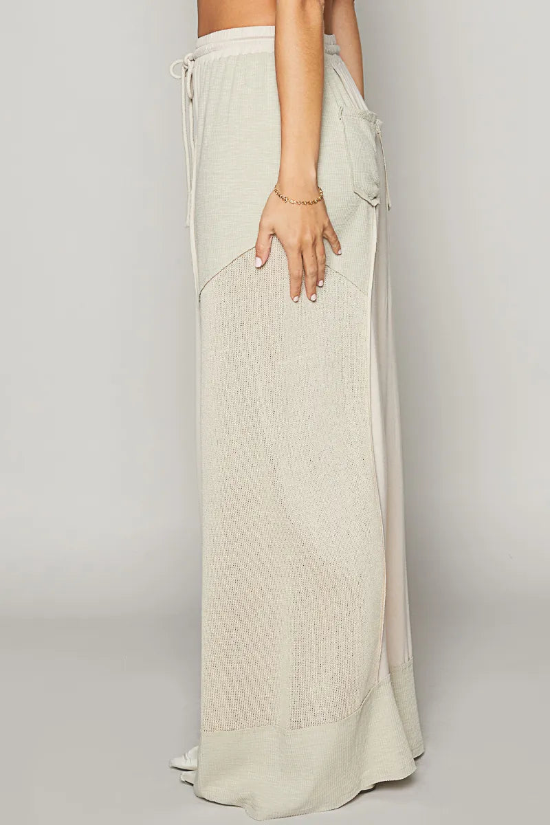 Cream wide-leg drawstring pants, elastic waist, side pocket and long flowy drape