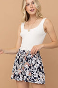 Floral print shorts with gathered elastic waist and black-and-cream flowers