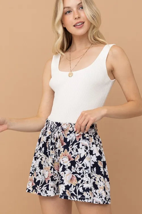 Floral print shorts with gathered elastic waist and black-and-cream flowers