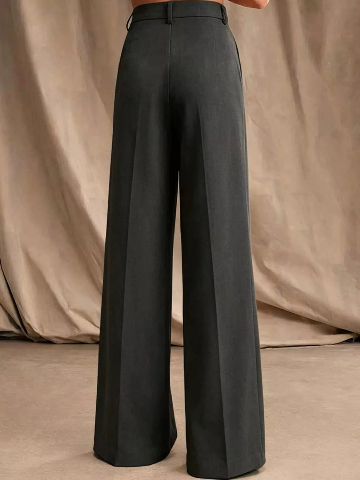 Black high-waisted pleated wide-leg pants, button closure, belt loops