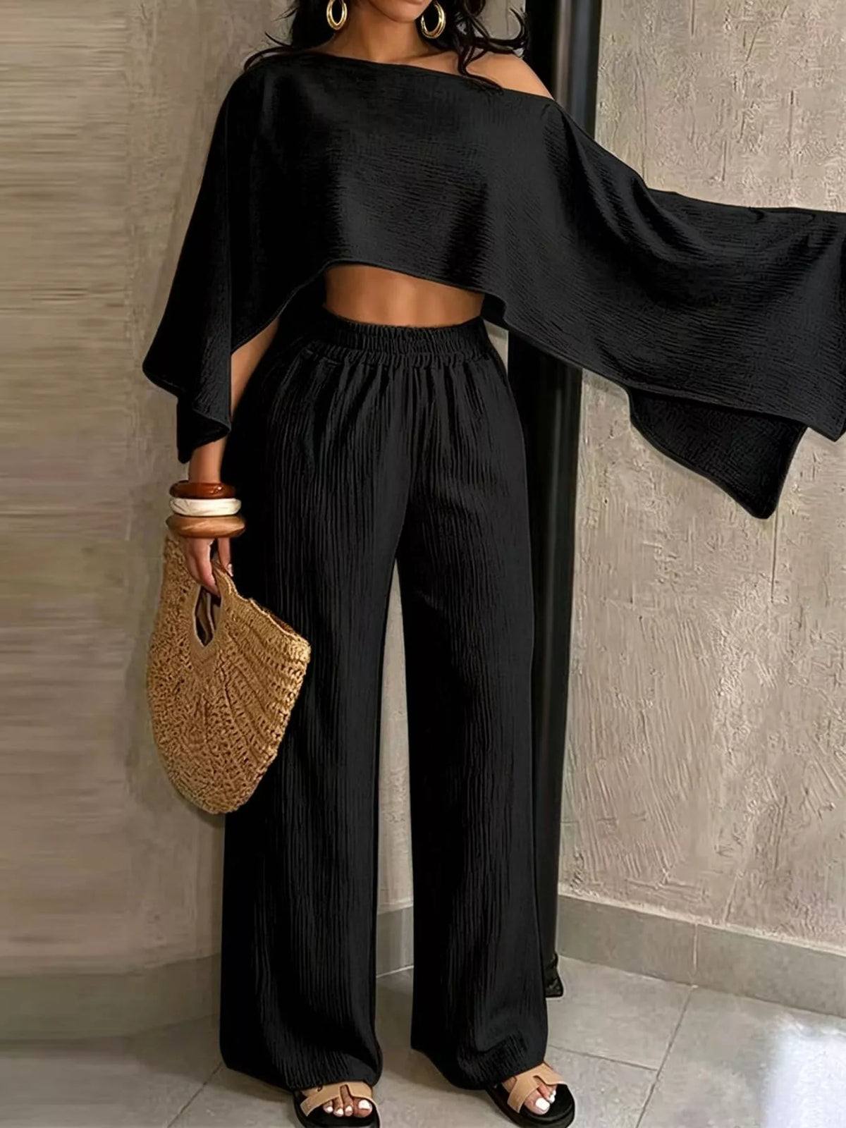 Black boat-neck crop top with loose sleeves and gathered wide-leg pants set