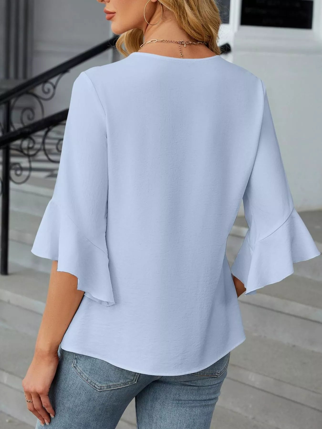 V-Neck Ruffle Sleeve Blouse in light blue with flared sleeves