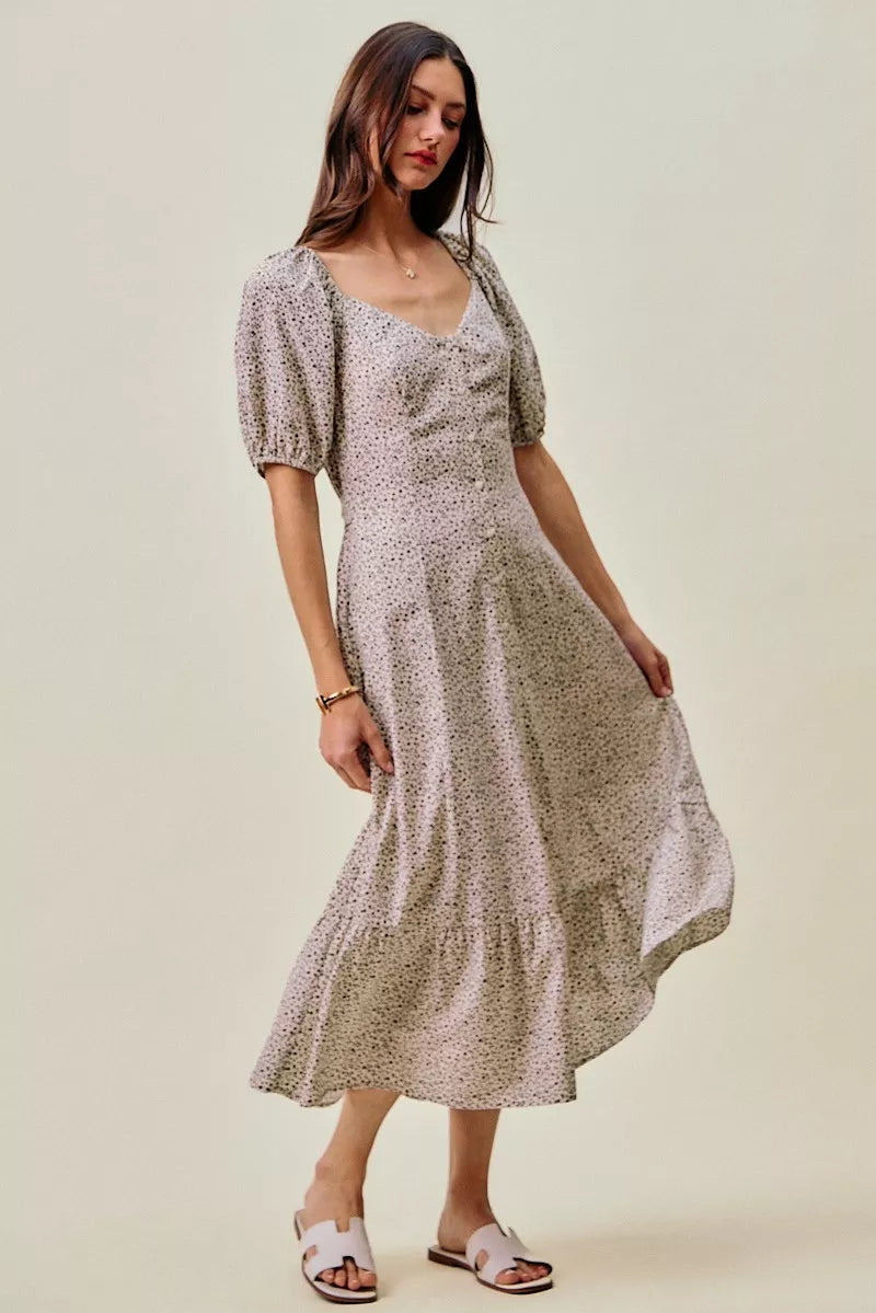 Off white/black ditsy floral dress with square neckline, puff sleeves, and tiered skirt