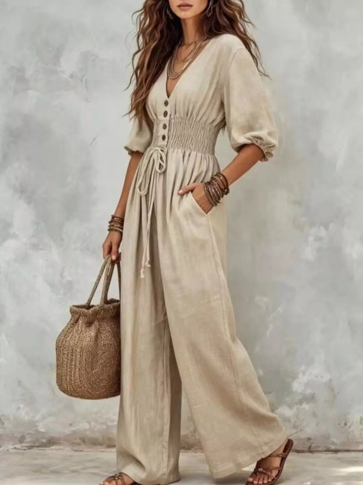 White v-neck smocked-waist wide-leg jumpsuit with drawstring waist and pockets