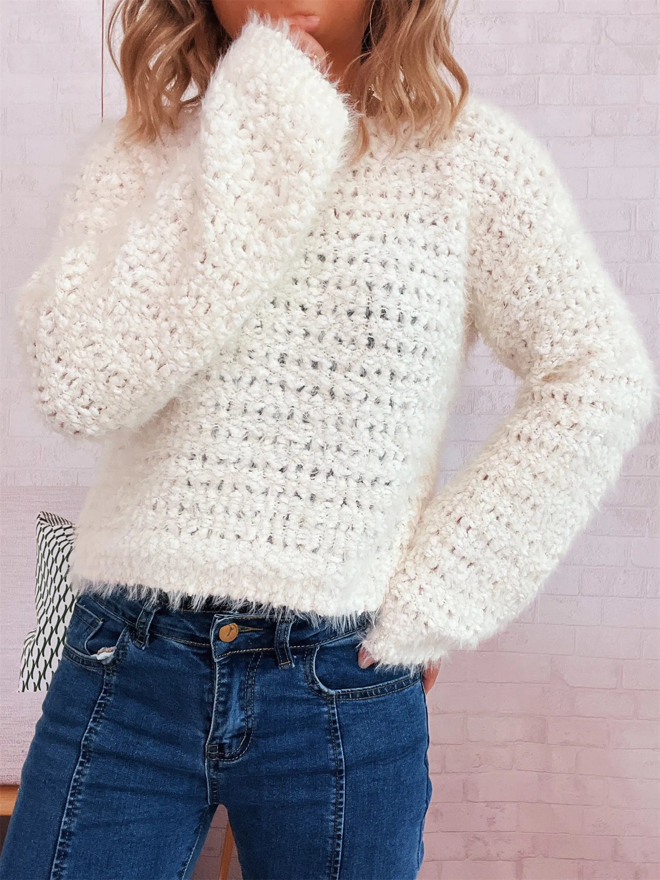 White crochet round-neck dropped-shoulder sweater with fuzzy open-knit texture, long sleeves