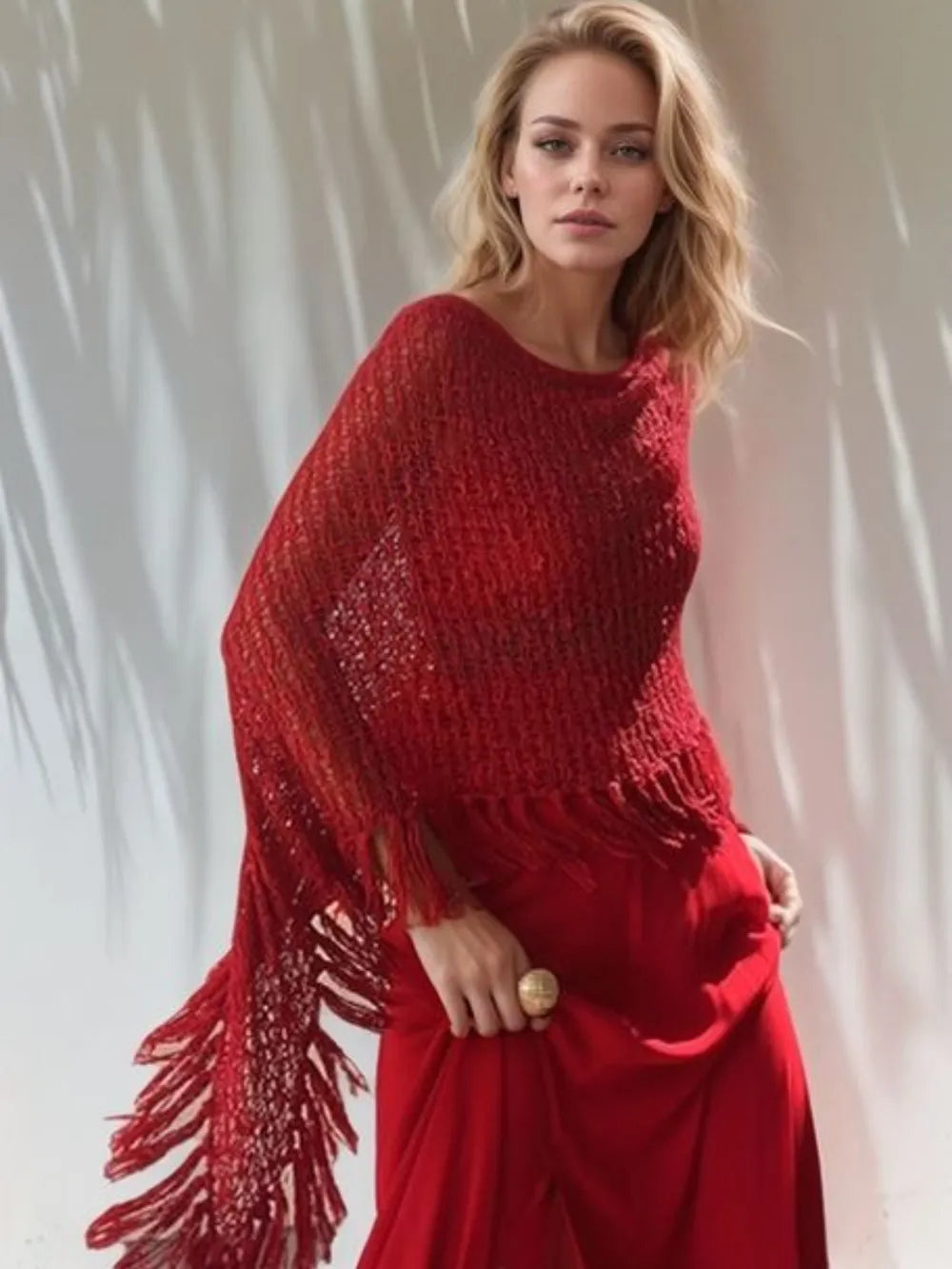 Deep red open-knit shawl with boat neck and long tassel fringe