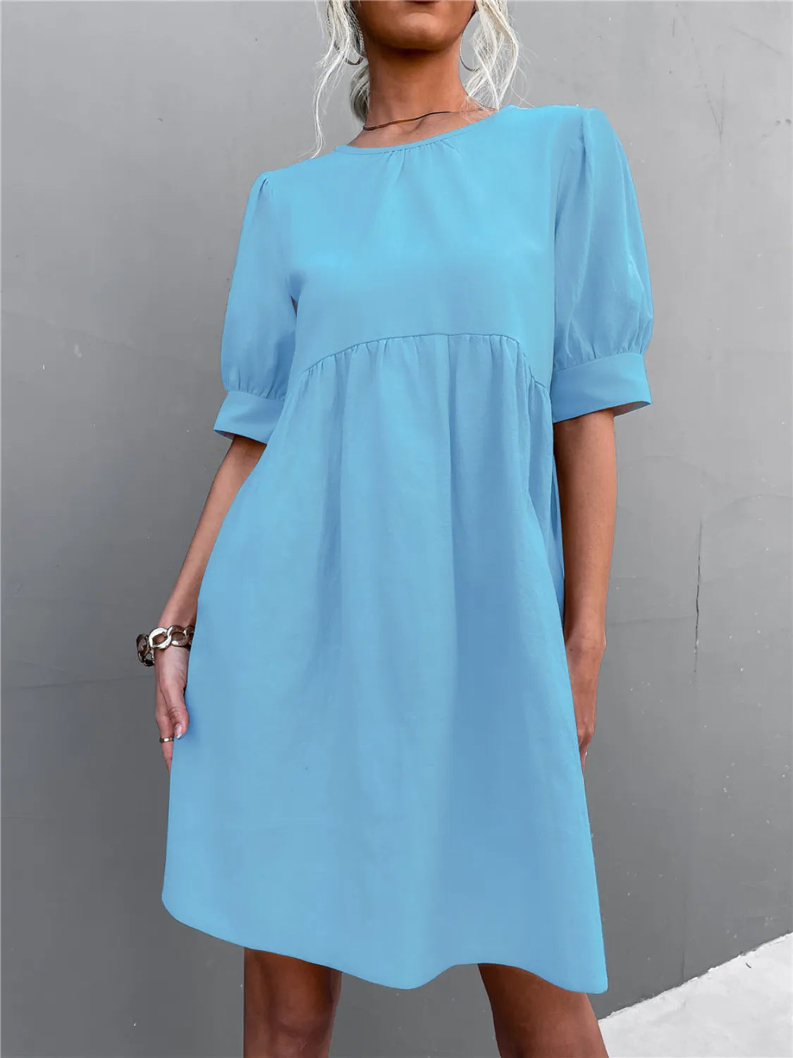 Round neck puff-sleeve mini dress in sky blue by Trendsi.