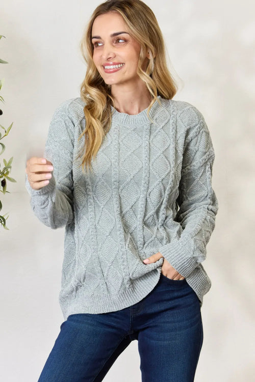 Dust sage cable knit round-neck sweater with long sleeves and ribbed cuffs