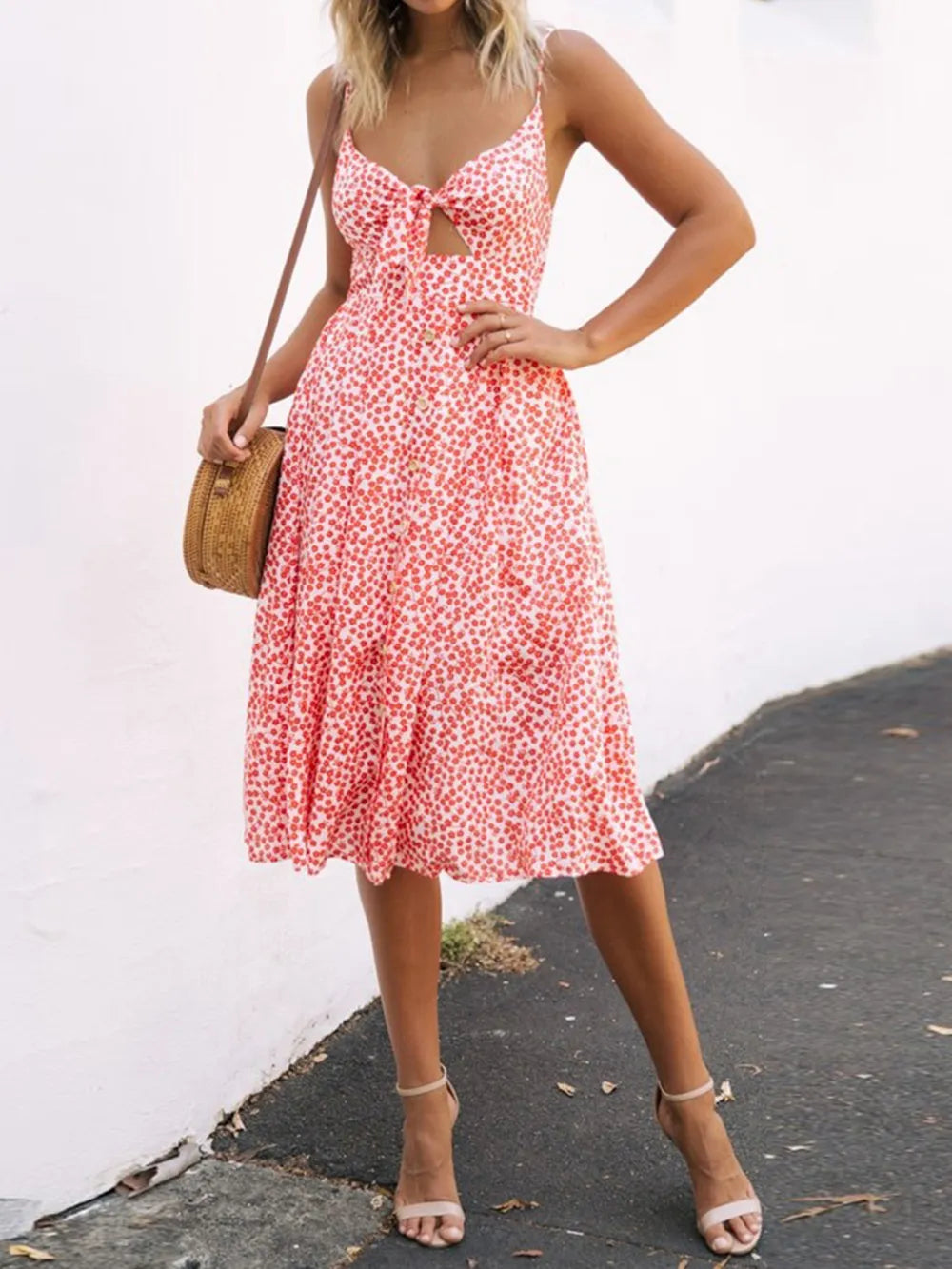 Pink floral cami dress with sweetheart cutout and bow tie front, midi length