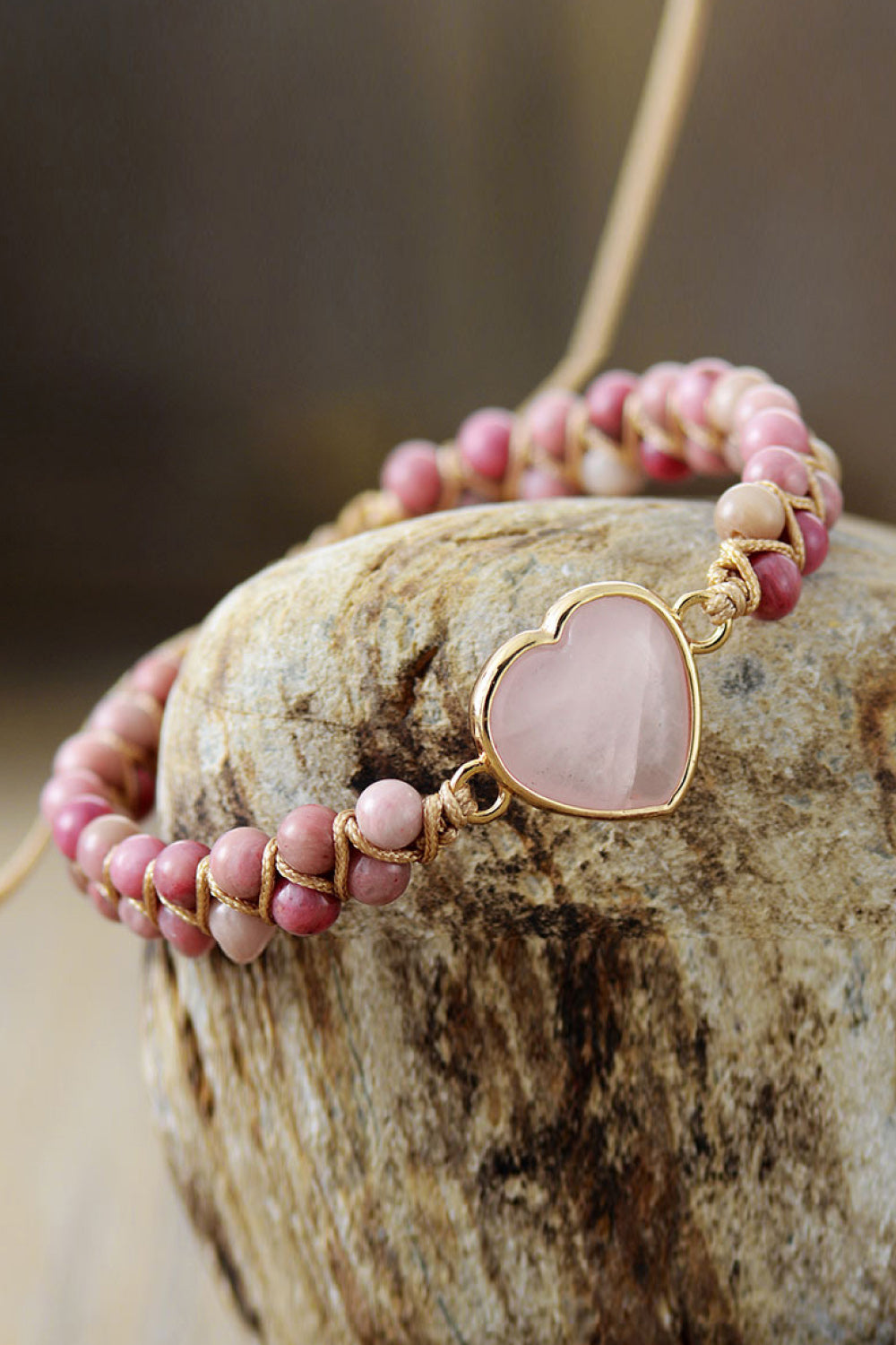 Dusty pink heart beaded bracelet with gold-tone heart setting and bead rows