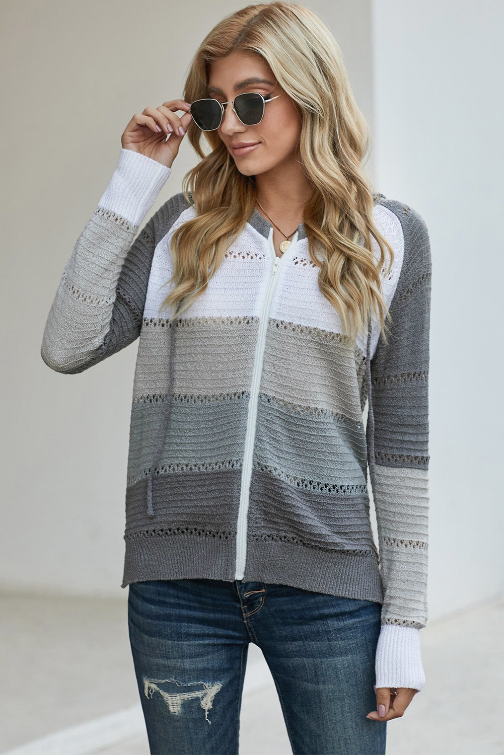 Gray zip-up hooded cardigan with openwork detail, white front panel and ribbed cuffs