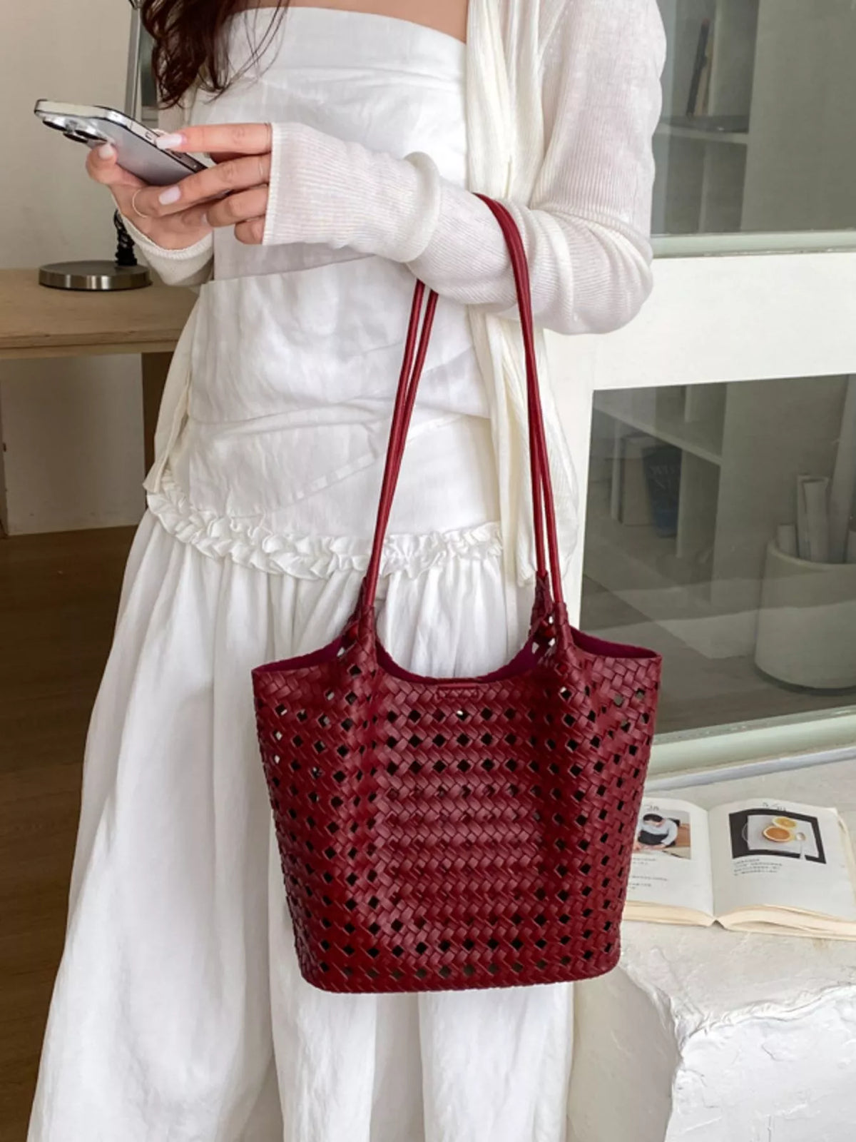 Red woven vegan leather medium shoulder bag with top handles and long strap