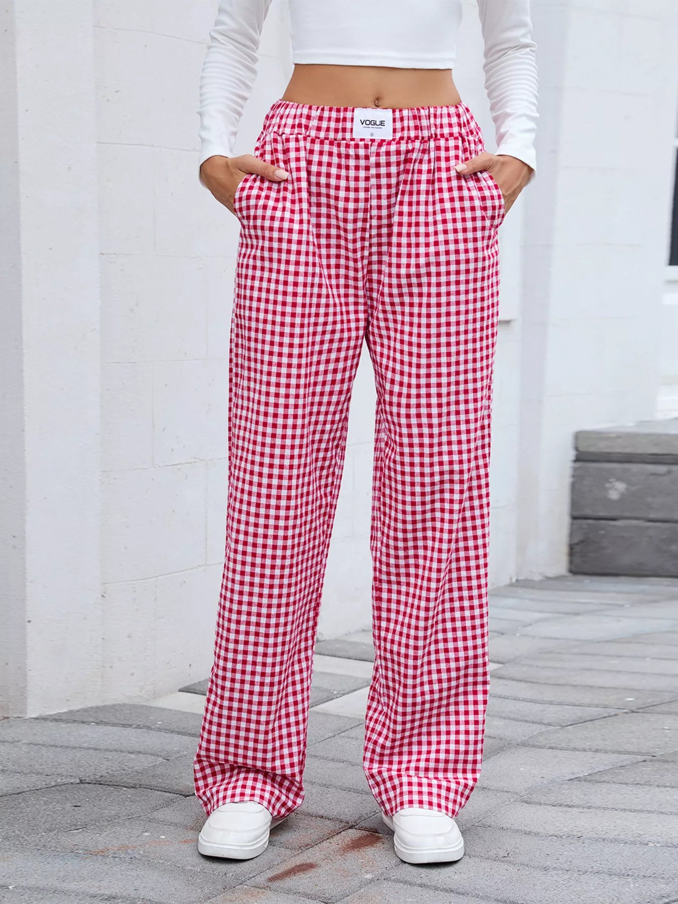 Plaid wide-leg casual pants in red and white, front view with elastic waist.