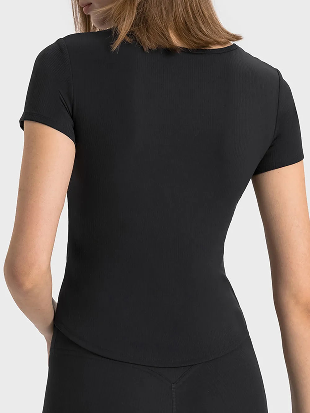 Black ribbed active t-shirt with short sleeves, draped back view