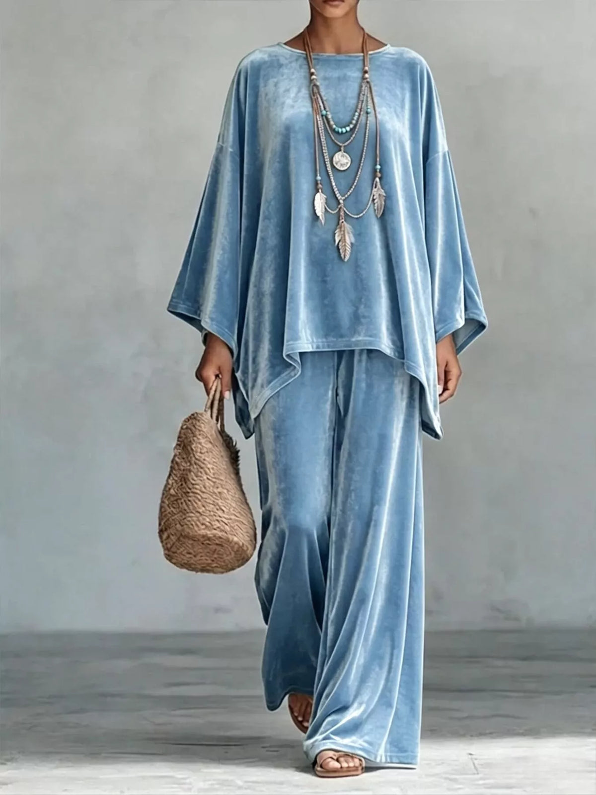 Light blue velvet wide-leg pants set with loose asymmetrical poncho-style top