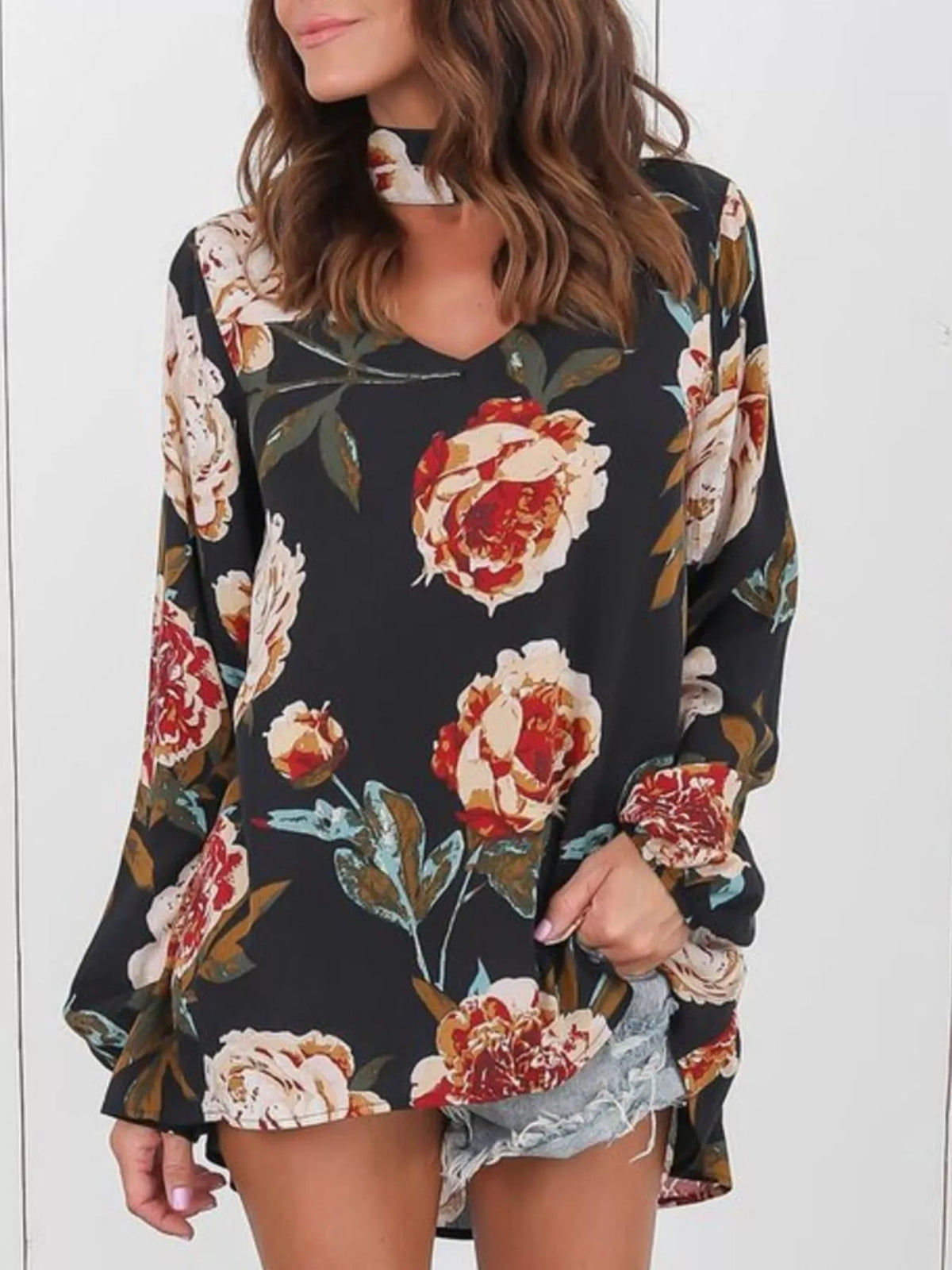 Black floral choker-neck long-sleeve blouse with red and cream flower print
