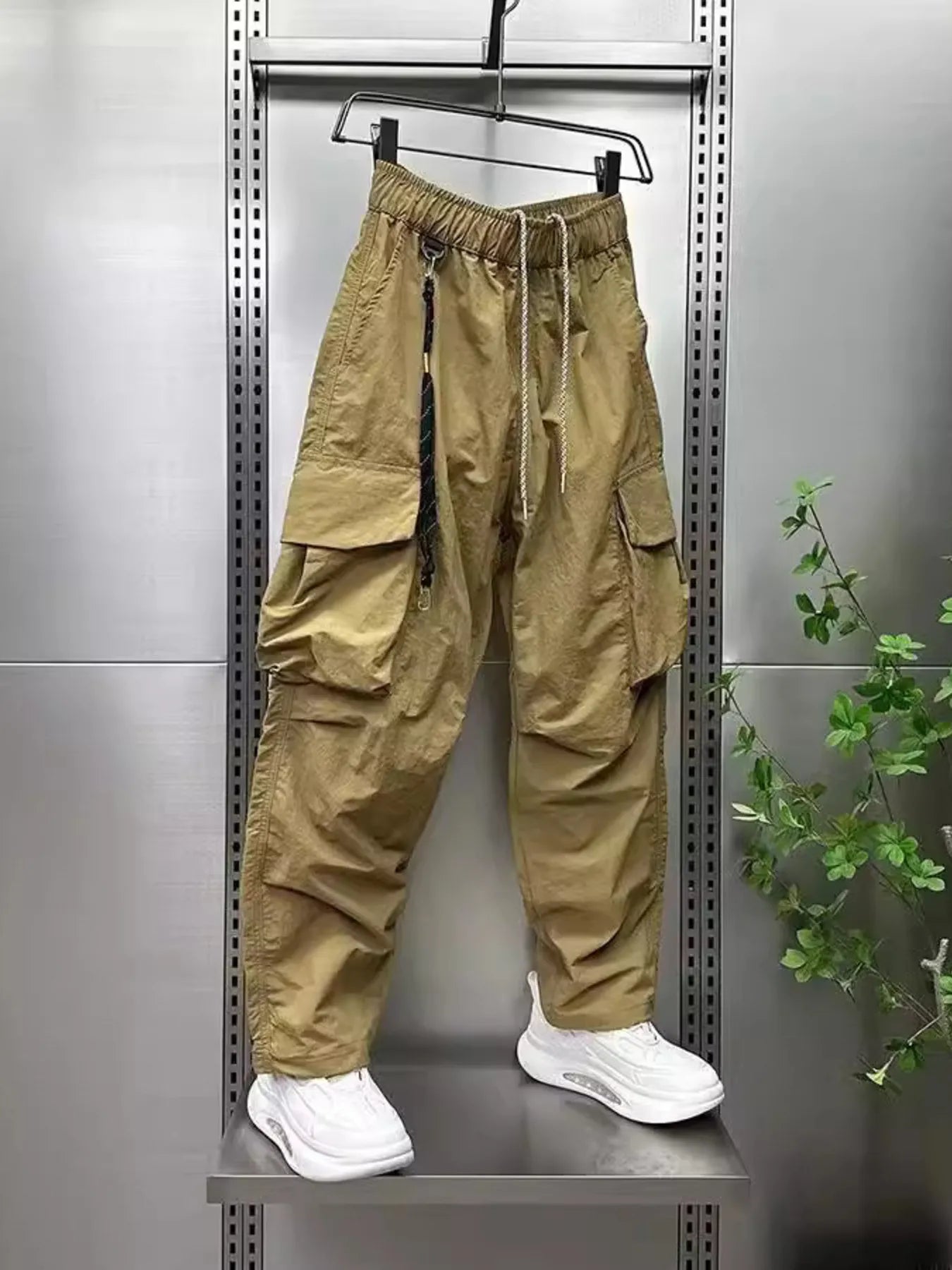 Men's plus size drawstring cargo pants, wide-leg, khaki with multiple cargo flaps.
