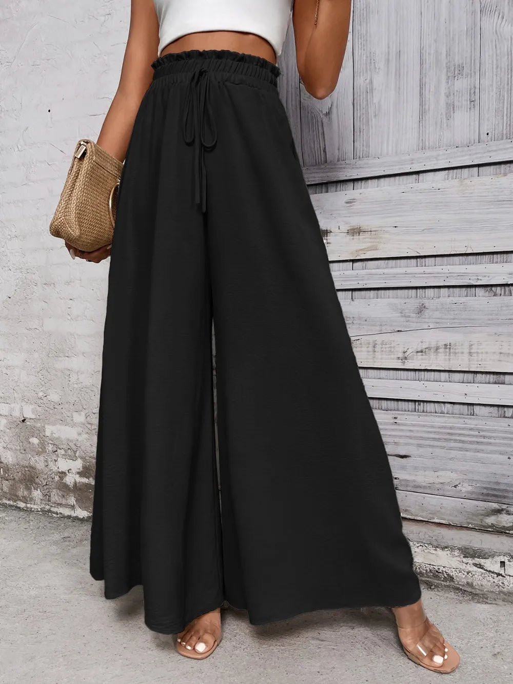 Black high waist wide-leg pants with elastic waistband and drawstring ties