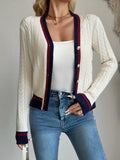 Ivory cable-knit button-front cardigan with V-neck and navy-red striped trim