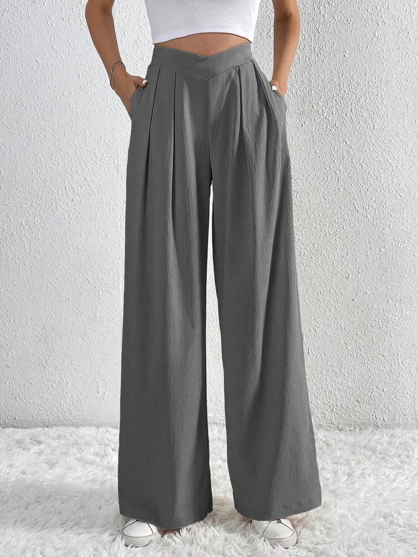 Dark gray wide-leg pants with ruched V-waist and relaxed wide-leg fit