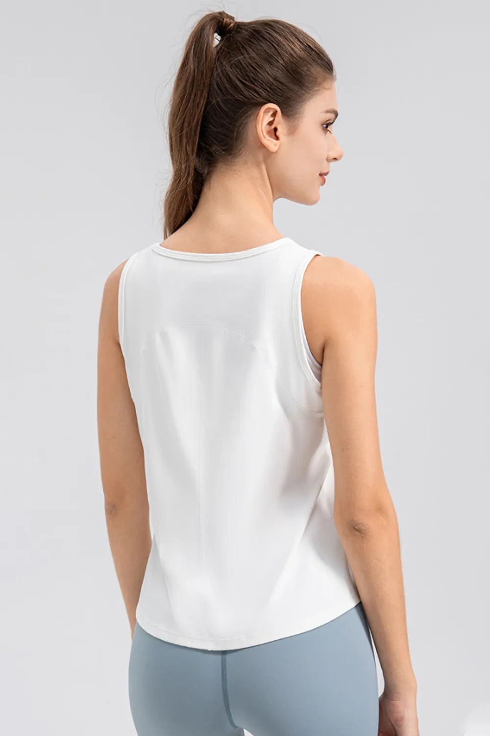 White active tank top with wide straps and round neckline, back view.