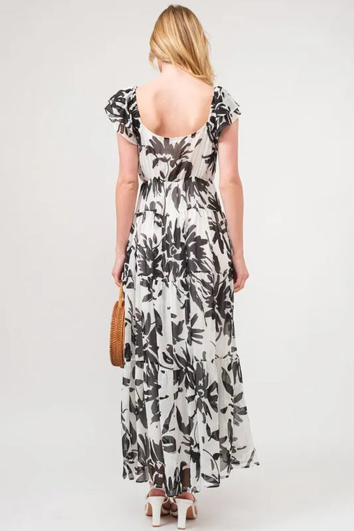 Cream and black floral print tiered maxi dress with ruffled back cap sleeves
