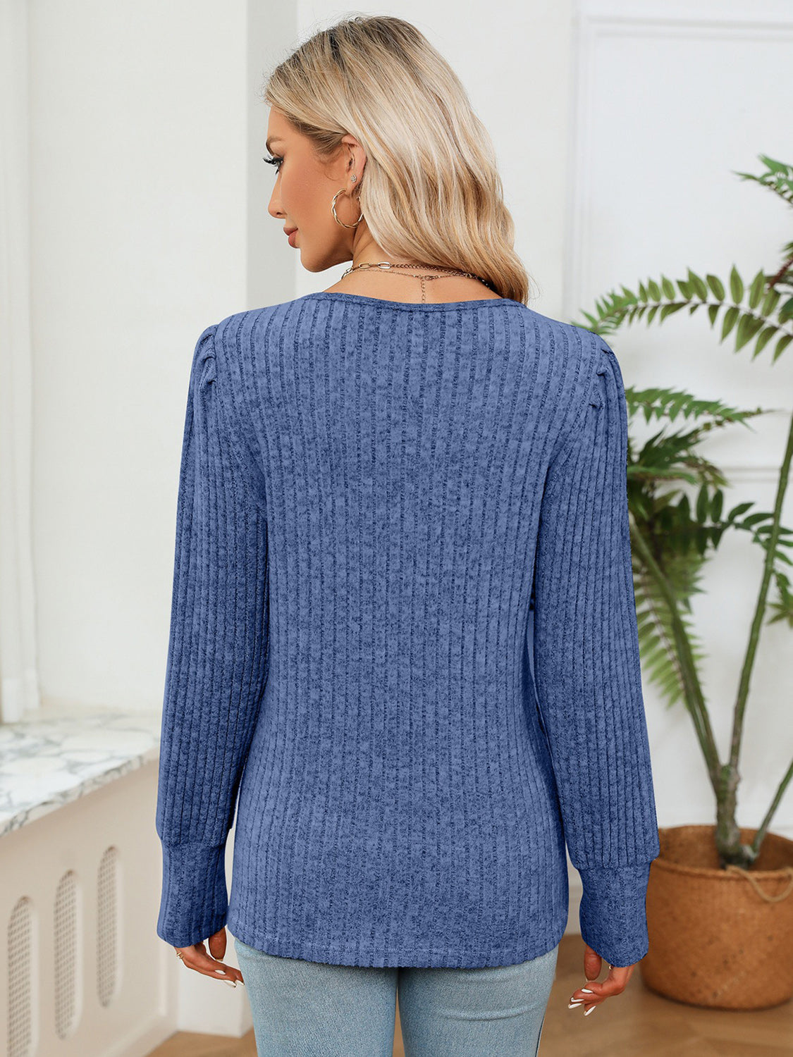 Cobalt blue ribbed blouse back view with long sleeves and rounded hem