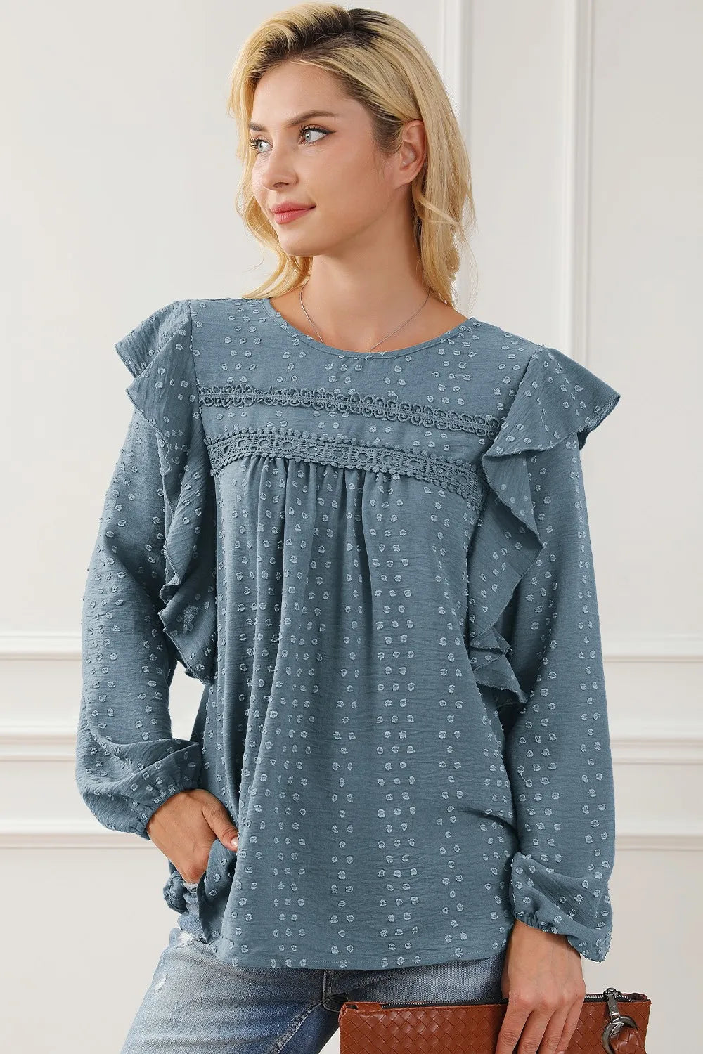 Blue round-neck ruffled blouse with elastic cuffs and gathered front yoke
