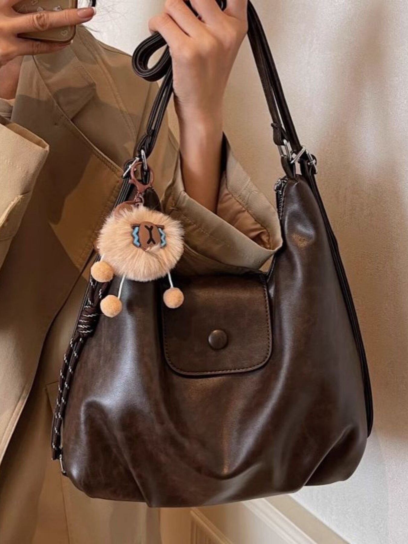 Adjustable Strap Shoulder Bag, medium, dark brown PU leather with front pocket and faux fur pom-pom charm.